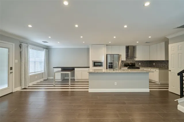 a view of kitchen with wooden floor and window