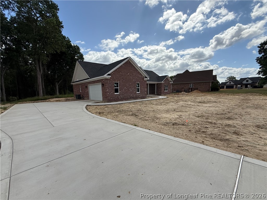 132 Ridge Stone Drive Autryville, NC 28318 - Photo 26 of 26 a front view of a house with a yard