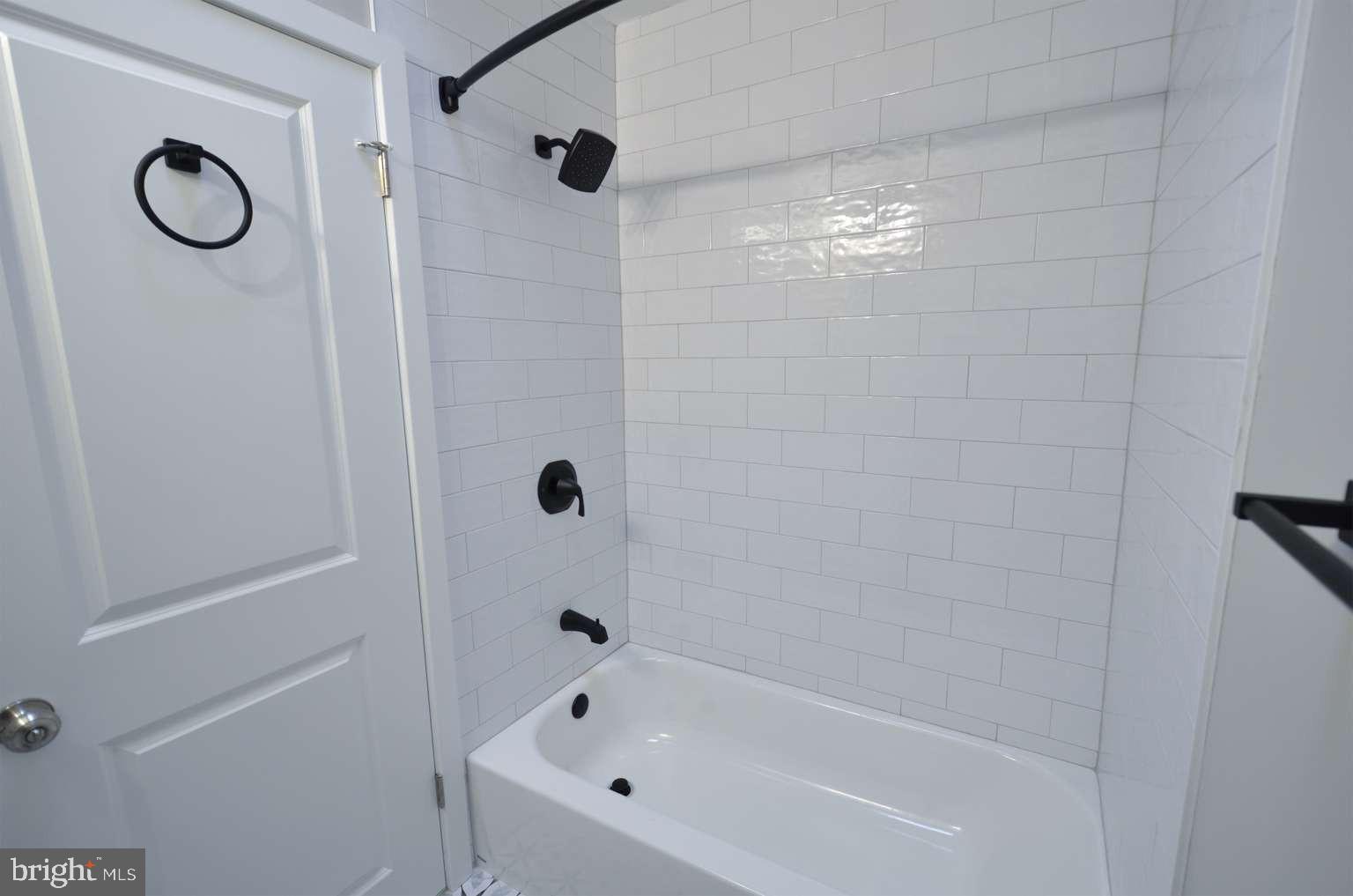 8213 Colfax Street Philadelphia, PA 19136 - Photo 15 of 25 a bathroom with a bathtub and a shower