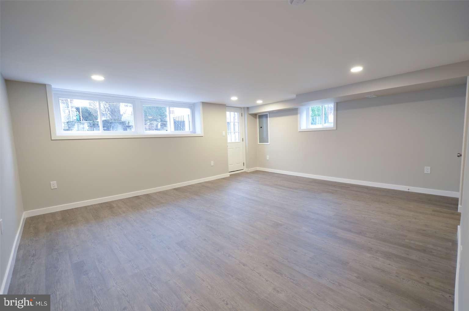 8213 Colfax Street Philadelphia, PA 19136 - Photo 17 of 25 a view of an empty room with wooden floor and a window