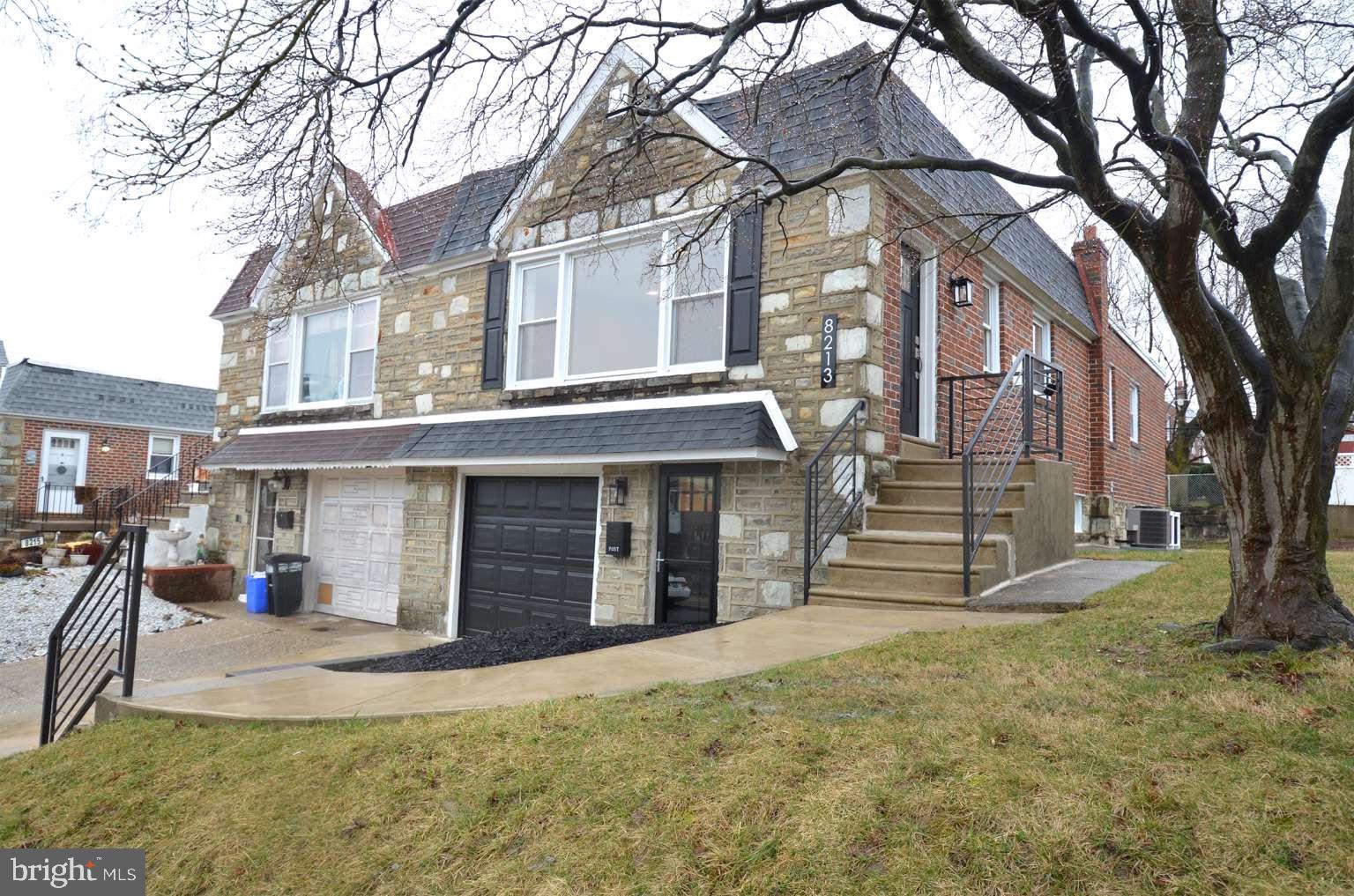 8213 Colfax Street Philadelphia, PA 19136 - Photo 2 of 25 a view of a house with a yard and large tree