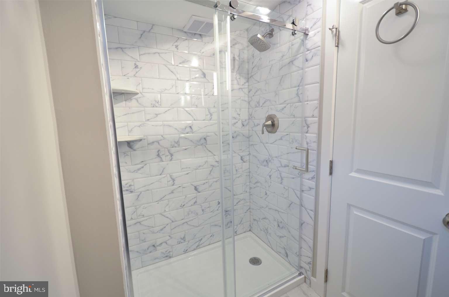 8213 Colfax Street Philadelphia, PA 19136 - Photo 23 of 25 a bathroom with a shower