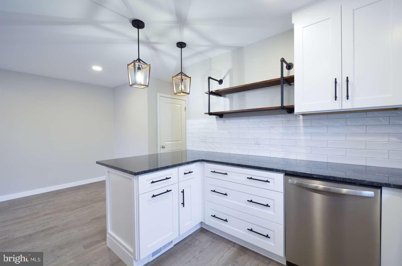 8213 Colfax Street Philadelphia, PA 19136 - Photo 6 of 25 a kitchen with cabinets and window