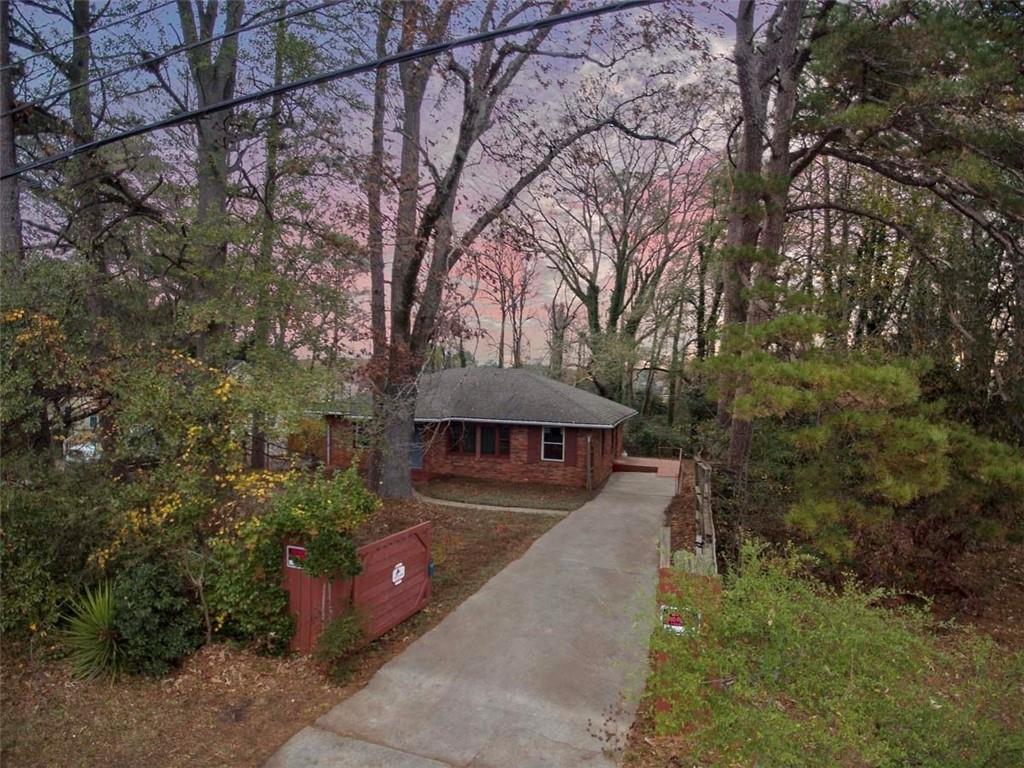 3308 Fern Drive Tucker, GA 30084 - Photo 3 of 19 a view of a yard with plants and a bench