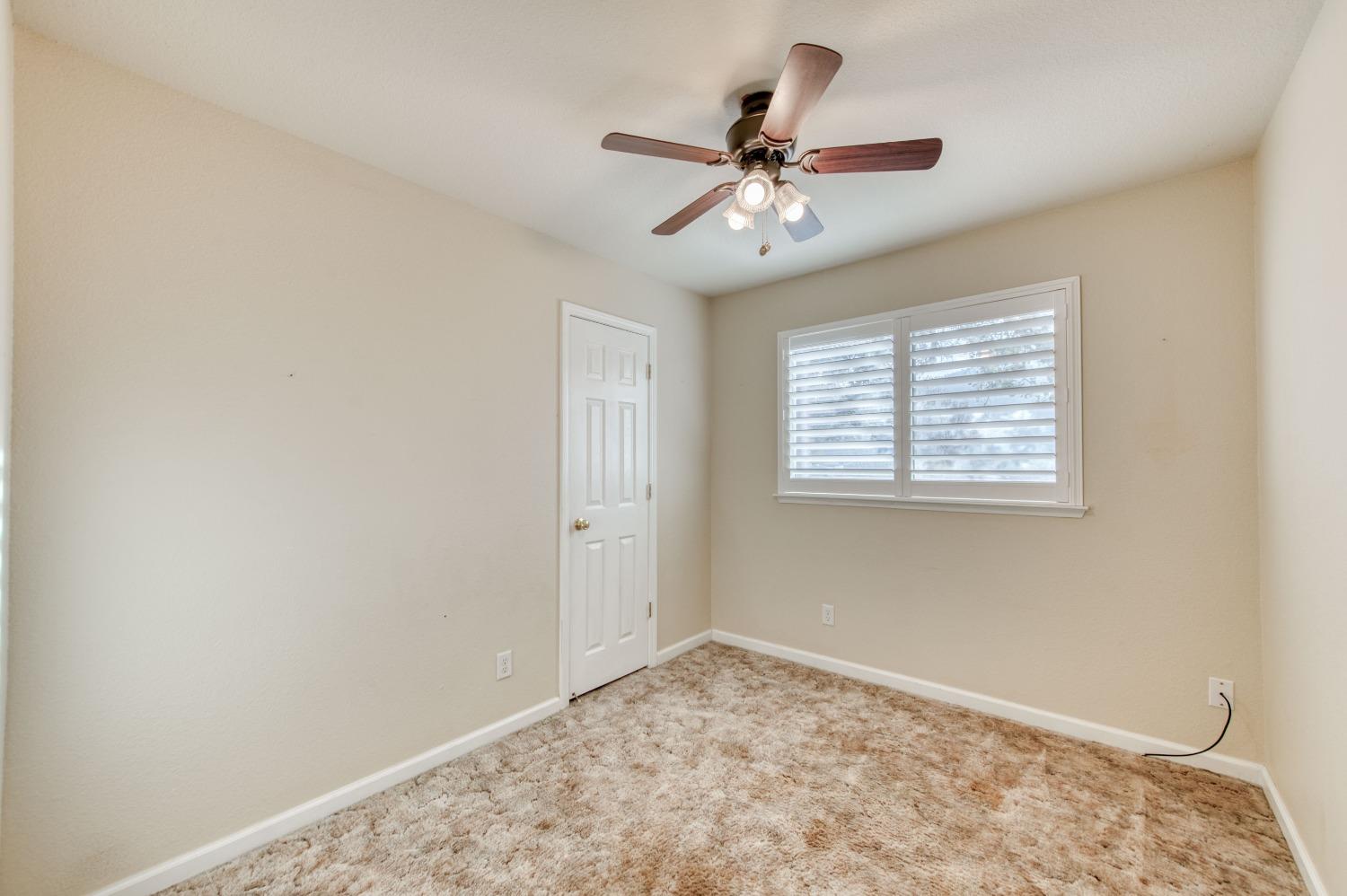 8062 Monreal Drive Sanger, CA 93657 - Photo 12 of 24 a view of a livingroom with a fan