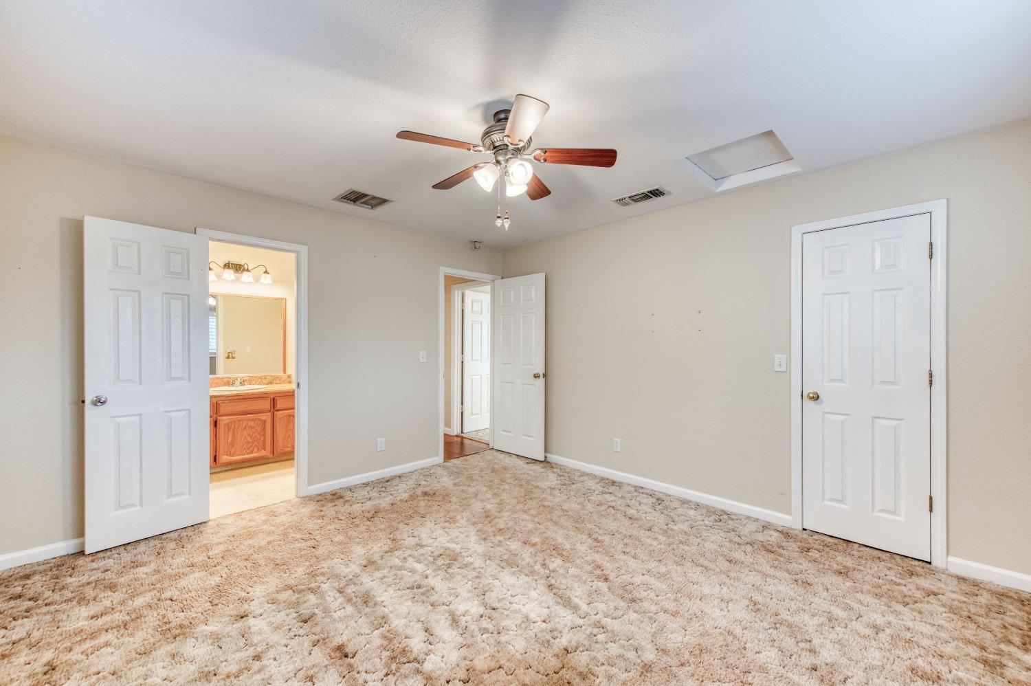 8062 Monreal Drive Sanger, CA 93657 - Photo 15 of 24 a view of an empty room and window ceiling fan