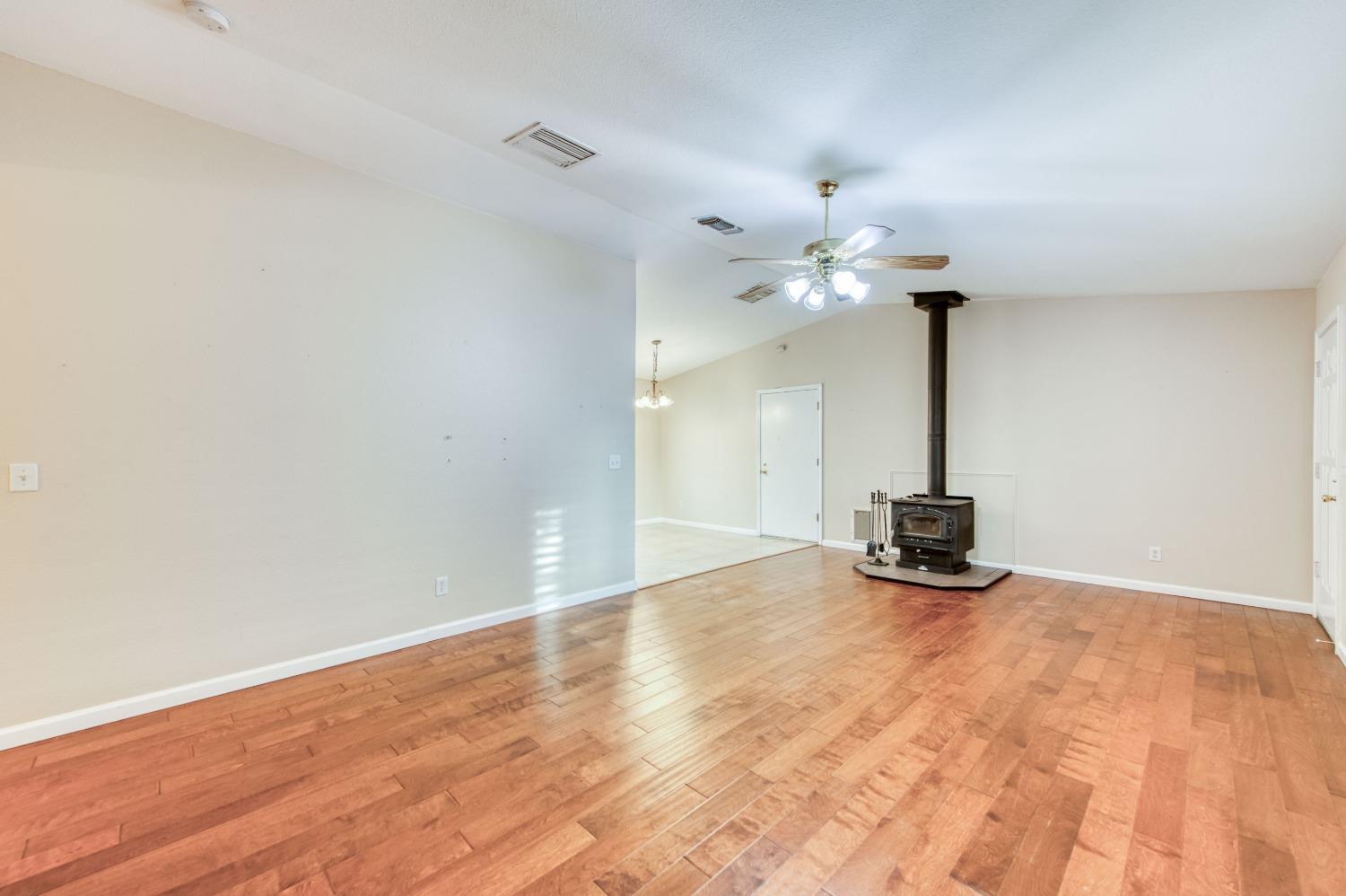 8062 Monreal Drive Sanger, CA 93657 - Photo 6 of 24 a view of an empty room and chandelier fan