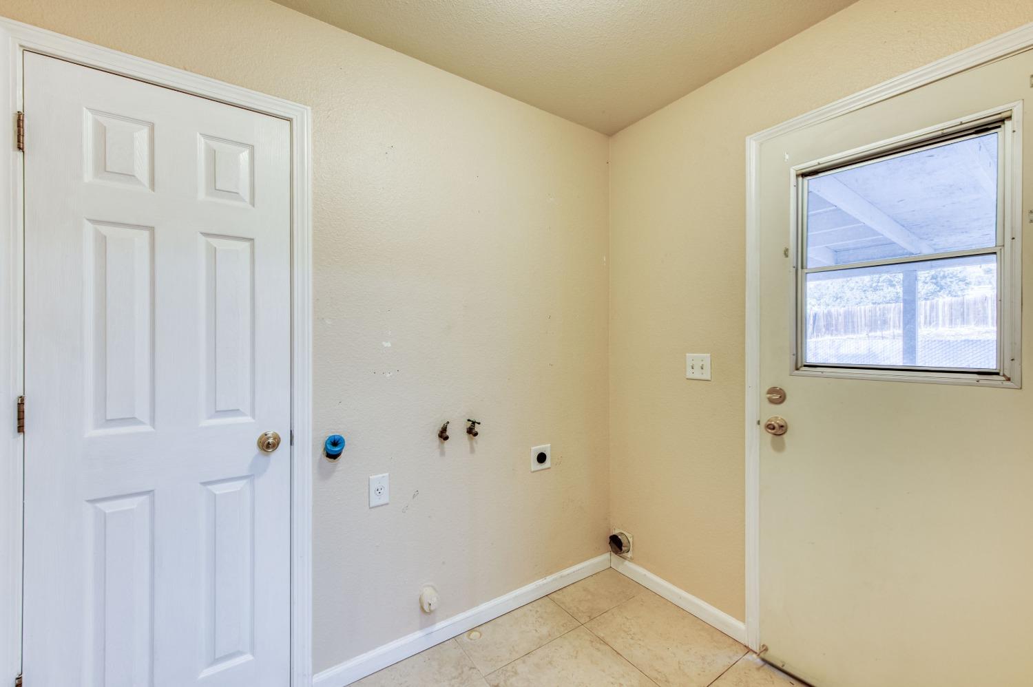 8062 Monreal Drive Sanger, CA 93657 - Photo 10 of 24 a view of a small space with wooden floor and a window