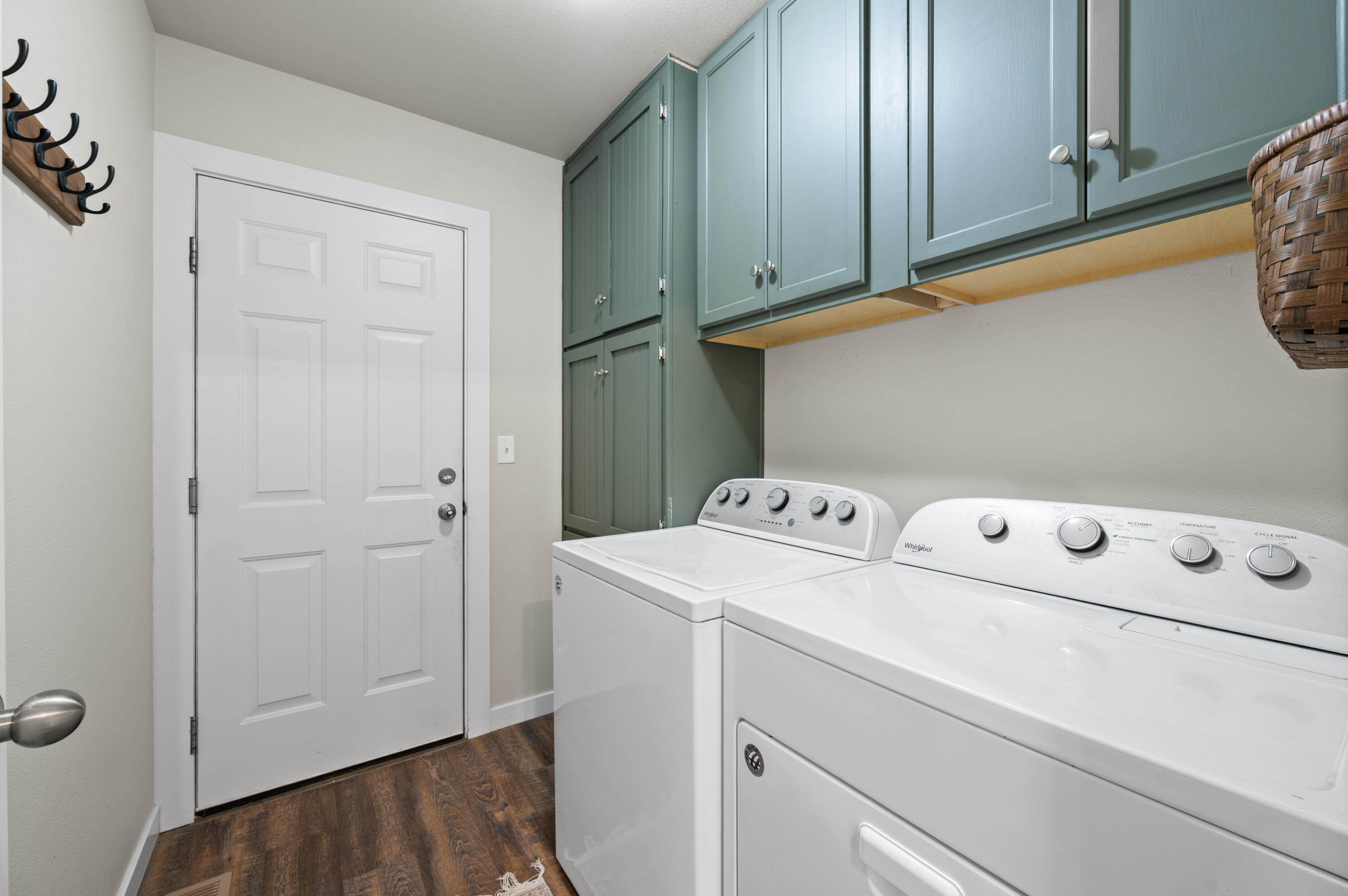 16625 Southwest Dove Road Terrebonne, OR 97760 - Photo 28 of 50 a view of washer and dryer with kitchen in the background