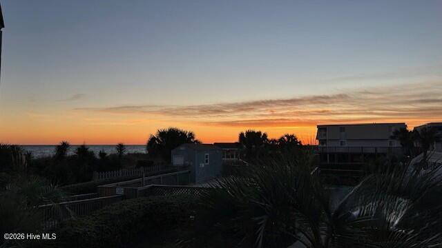 277 West First Street, Unit 1I Ocean Isle Beach, NC 28469 - Photo 14 of 43 Sunset view from covered deck.