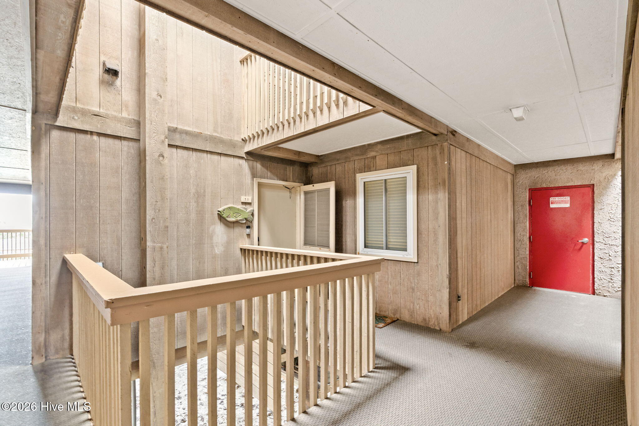 277 West First Street, Unit 1I Ocean Isle Beach, NC 28469 - Photo 40 of 43 Interior hallway to front door.
