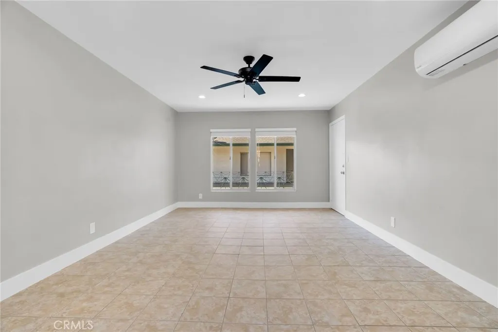 5828 Whitsett Avenue Valley Village, CA 91607 - Photo 14 of 27 wooden floor in an empty room with a window