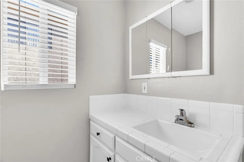 5828 Whitsett Avenue Valley Village, CA 91607 - Photo 16 of 27 a bathroom with a sink and a window