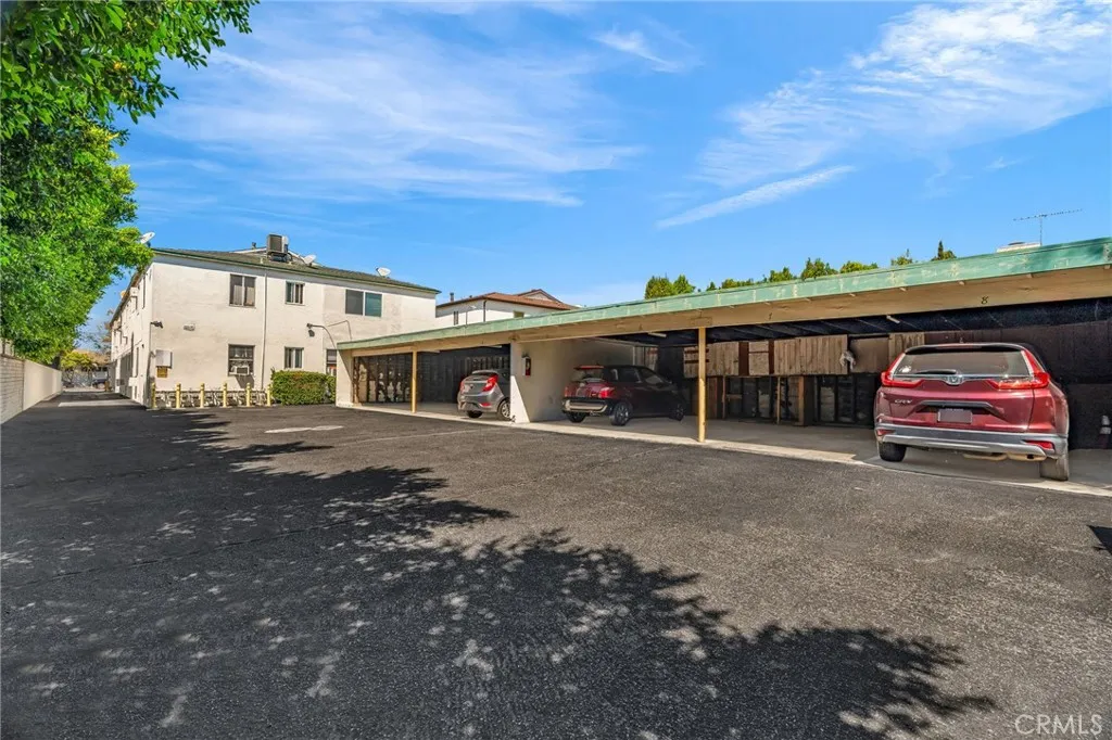 5828 Whitsett Avenue Valley Village, CA 91607 - Photo 25 of 27 a front view of a house with parking space and a car parked in it