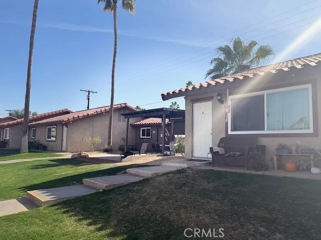 a balcony with table and chairs