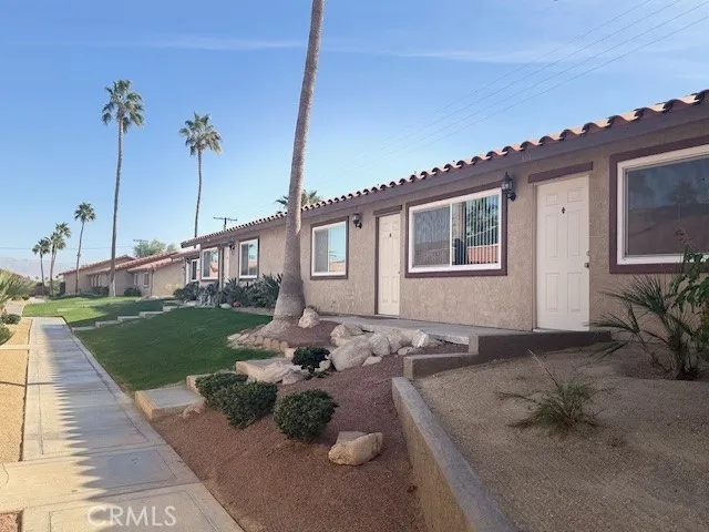 a very nice looking house with a yard