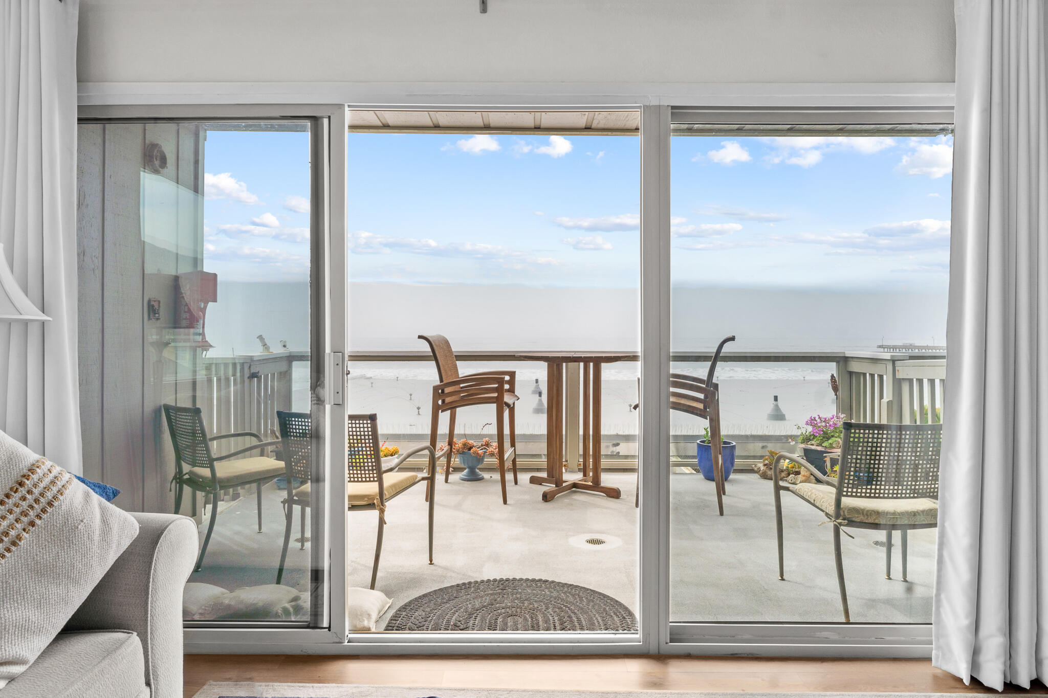 77 North Ocean Avenue, Unit 12 Cayucos, CA 93430 - Photo 1 of 41 a view of a living room and a dining table with garden view