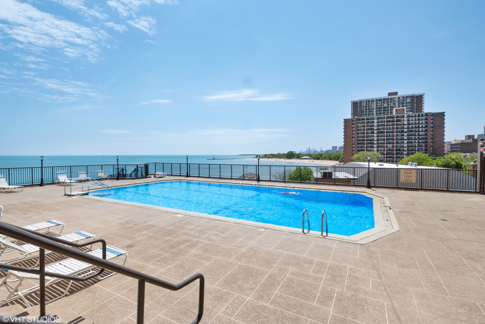 6007 North Sheridan Road, Unit 32D Chicago, IL 60660 - Photo 3 of 20 a view of a swimming pool with a lounge chair