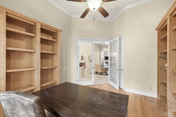 a living room with furniture and a piano