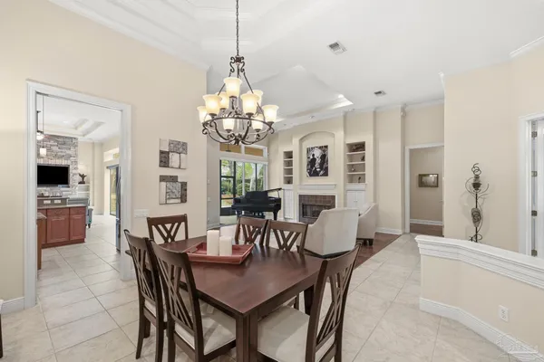 a kitchen with stainless steel appliances granite countertop a refrigerator and a stove