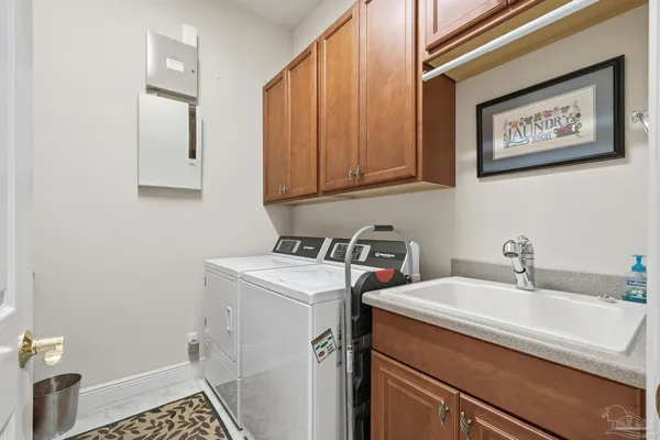 a large kitchen with kitchen island granite countertop a sink and a large window