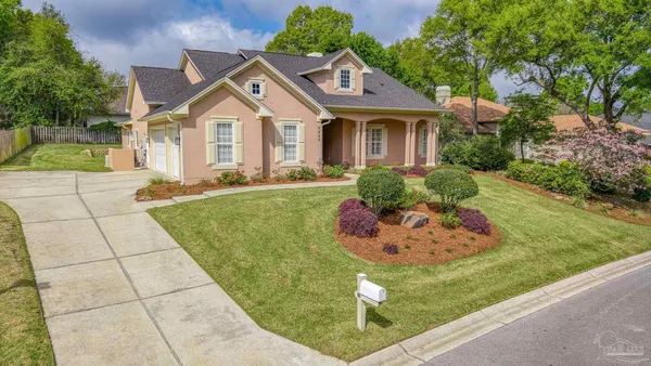 a front view of a house with a yard