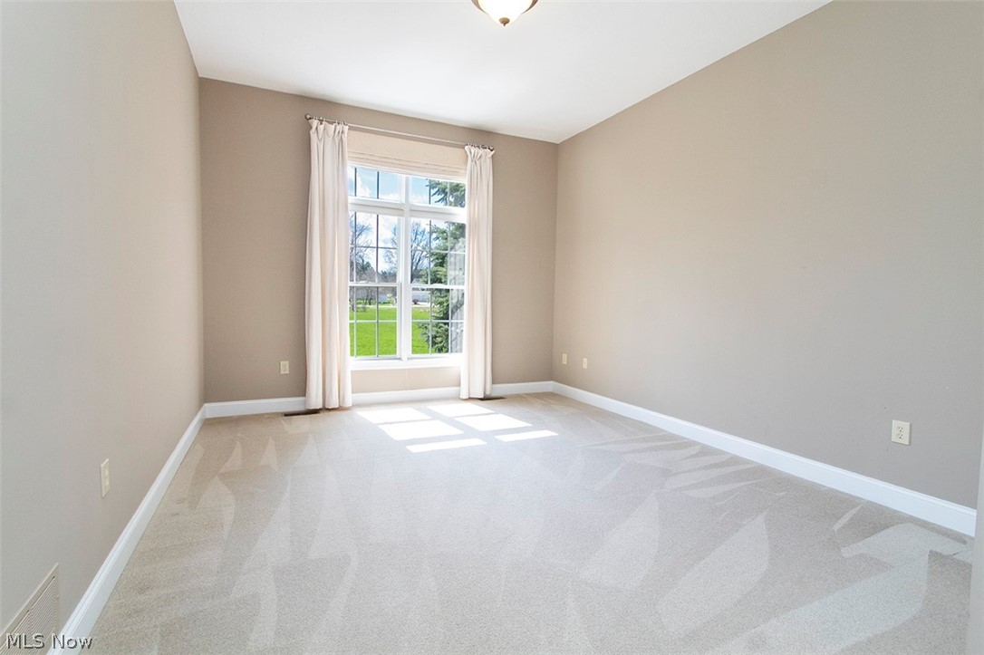 2201 Granger Road Medina, OH 44256 - Photo 22 of 34 Bedroom featuring light carpet and baseboards