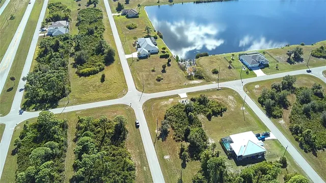 an aerial view of a residential houses with outdoor space