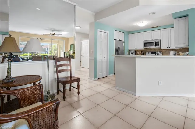 a kitchen with stainless steel appliances a refrigerator and a stove top oven