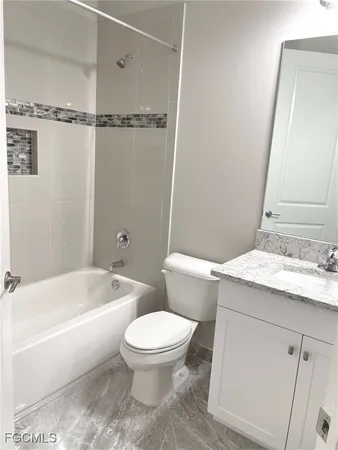 a bathroom with a sink a toilet and a bathtub