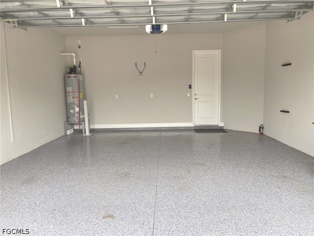 4129 Amelia Way Naples, FL 34119 - Photo 21 of 23 a view of a room with rack on the wall