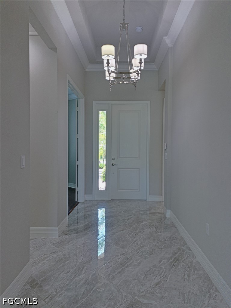 4129 Amelia Way Naples, FL 34119 - Photo 4 of 23 a view of a chandelier in a room