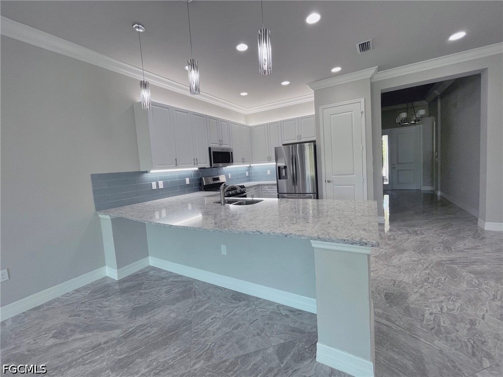 4129 Amelia Way Naples, FL 34119 - Photo 5 of 23 a view of a kitchen counter space