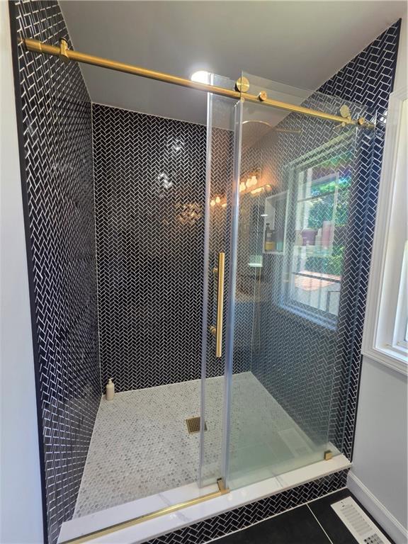 150 Sims Street Winder, GA 30680 - Photo 26 of 61 a bathroom with a shower