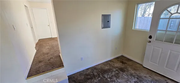 a room with a rug and a window