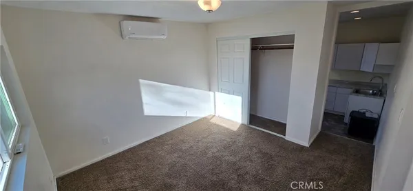 wooden floor in an empty room and a window