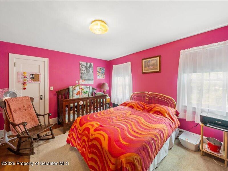 71 Pleasant Avenue Thompson, PA 18465 - Photo 17 of 37 a bedroom with bed and a window