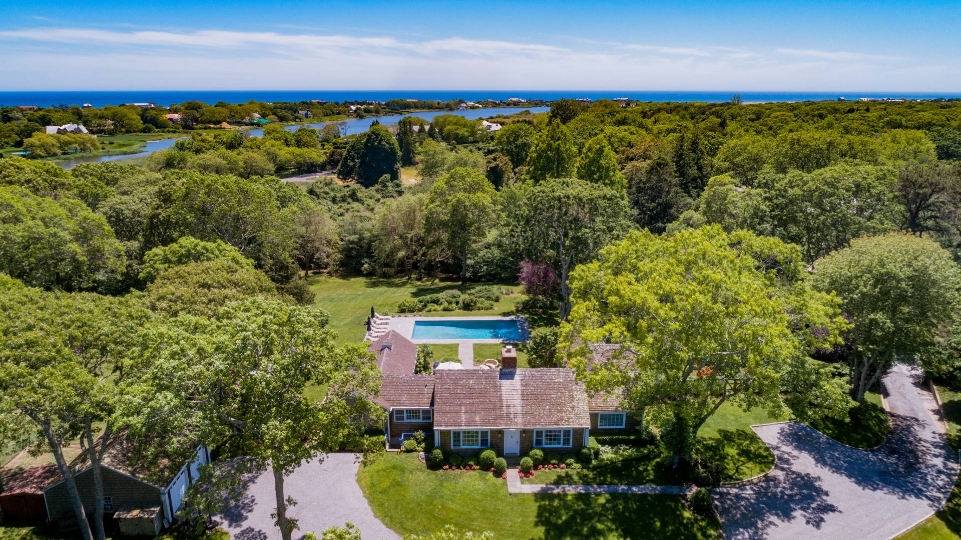 253 Georgica Road East Hampton, NY 11937 - Photo 1 of 19 an aerial view of a house with a yard