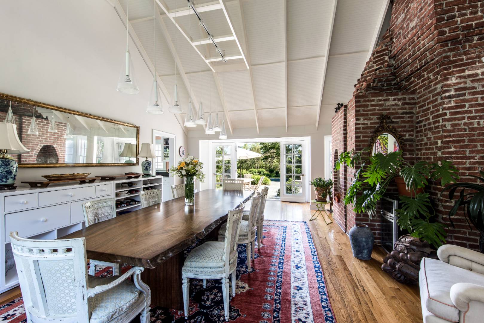 253 Georgica Road East Hampton, NY 11937 - Photo 11 of 19 a view of a dining room with furniture window and wooden floor