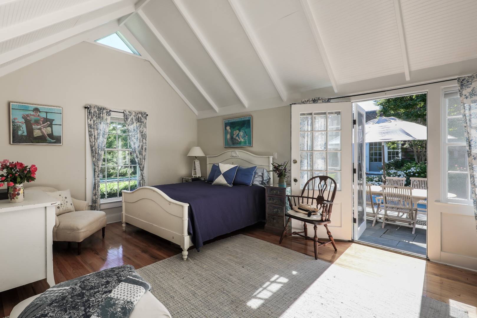 253 Georgica Road East Hampton, NY 11937 - Photo 12 of 19 a bedroom with furniture and a large window