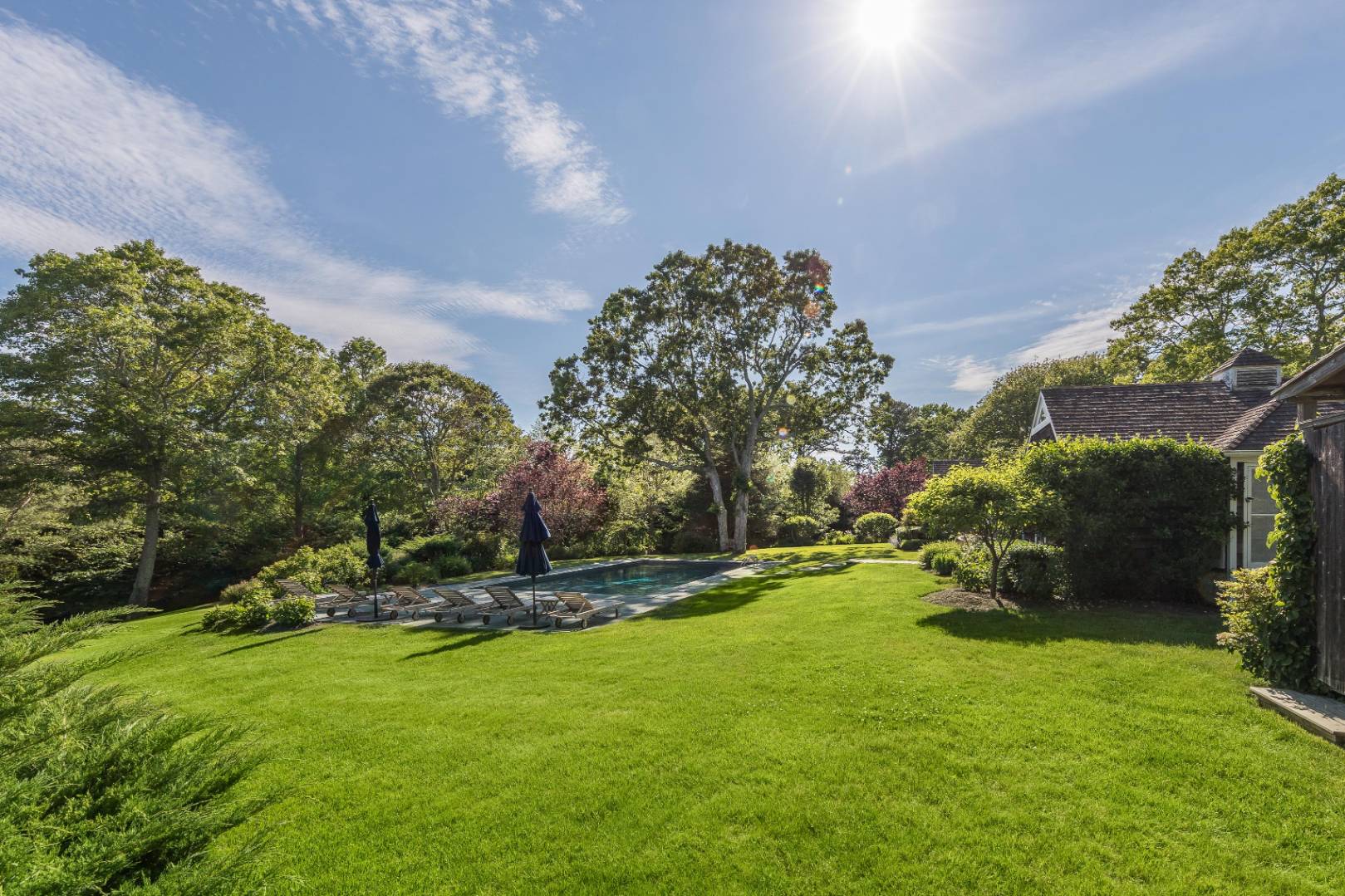 253 Georgica Road East Hampton, NY 11937 - Photo 18 of 19 a view of a fire pit in front of a house