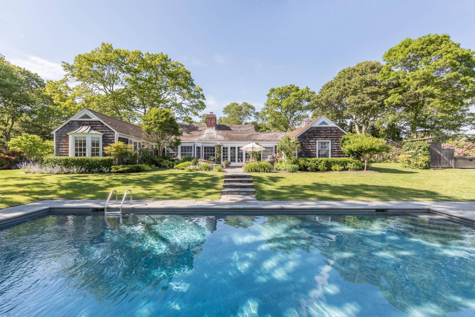 253 Georgica Road East Hampton, NY 11937 - Photo 5 of 19 a view of swimming pool with outdoor seating and yard
