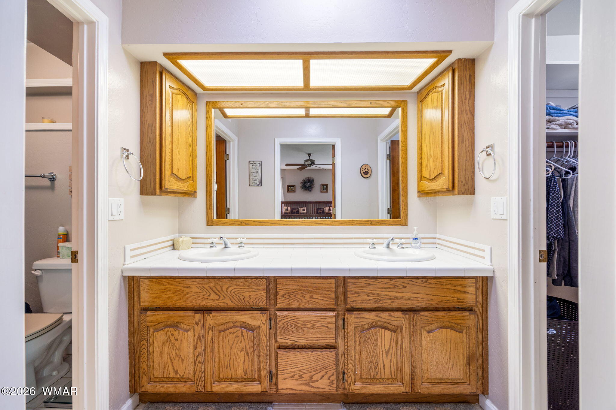 2922 Pine Rim Road Overgaard, AZ 85933 - Photo 23 of 58 a bathroom with a sink and a mirror