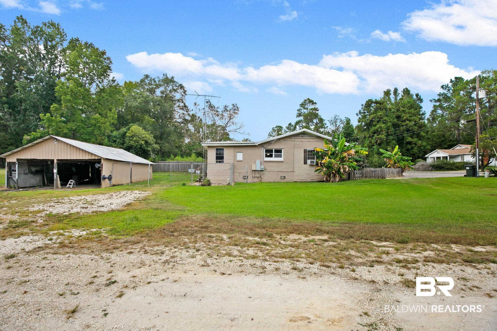 23240 County Road 47 Perdido, AL 36562 - Photo 24 of 29 Rear view of house with crawl space, an outbuilding, and an outdoor structure