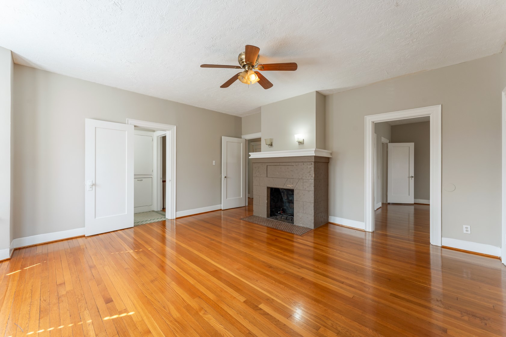 2624 Arbor Street Houston, TX 77004 - Photo 11 of 26 a view of empty room with wooden floor and fireplace