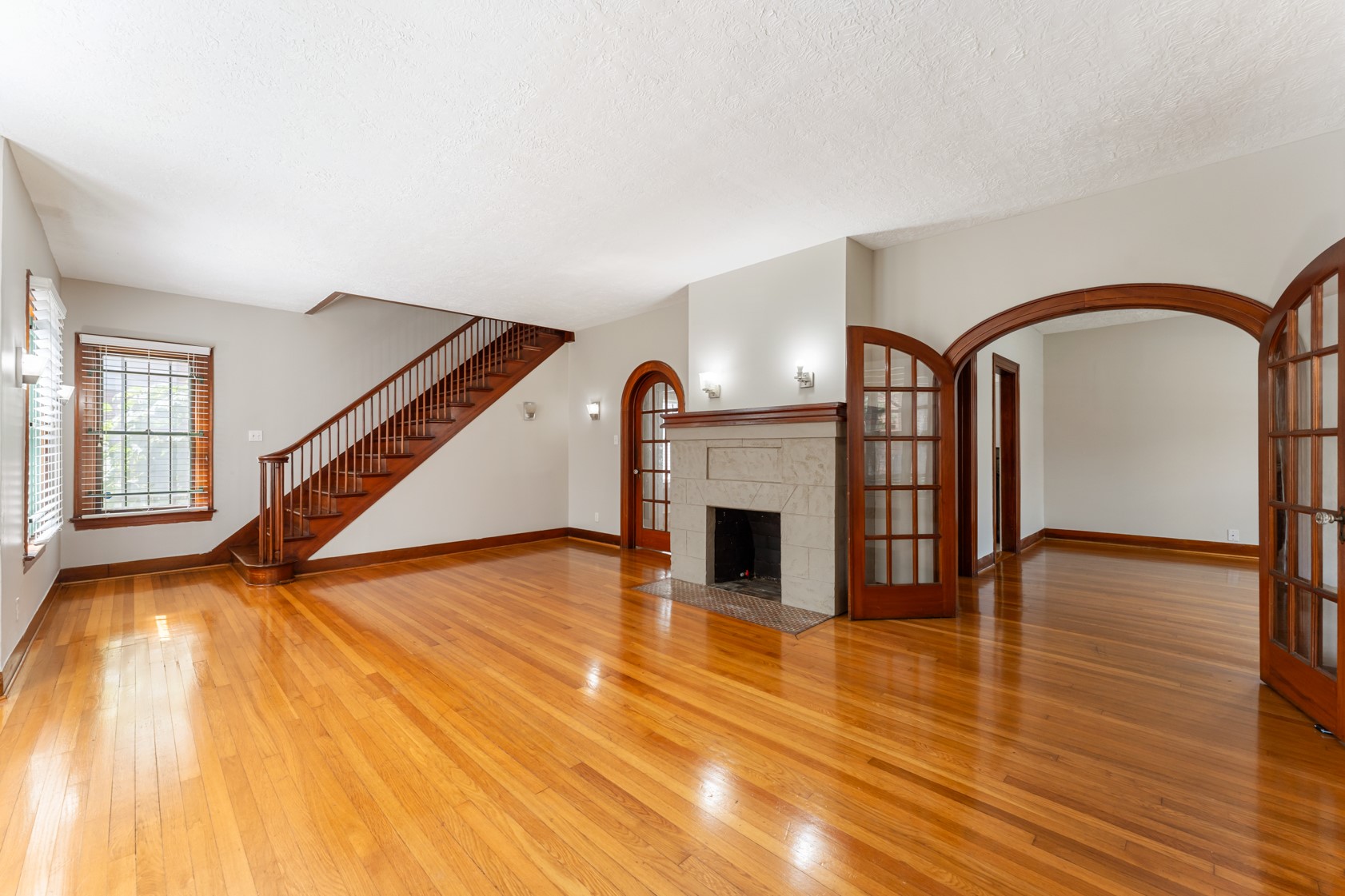 2624 Arbor Street Houston, TX 77004 - Photo 2 of 26 a view of empty room with fireplace and wooden floor