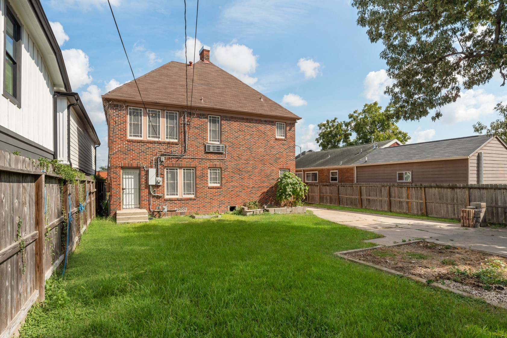 2624 Arbor Street Houston, TX 77004 - Photo 25 of 26 a front view of a house with a yard and trees