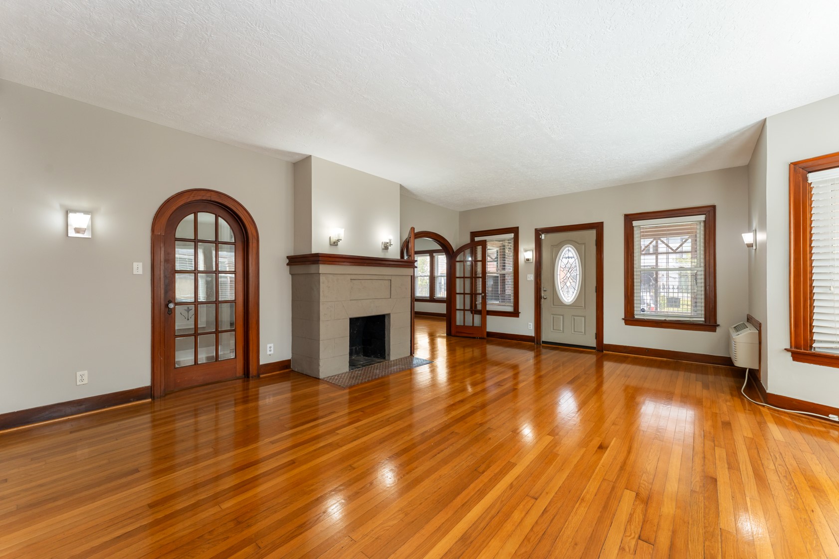 2624 Arbor Street Houston, TX 77004 - Photo 3 of 26 a view of empty room with wooden floor and fireplace