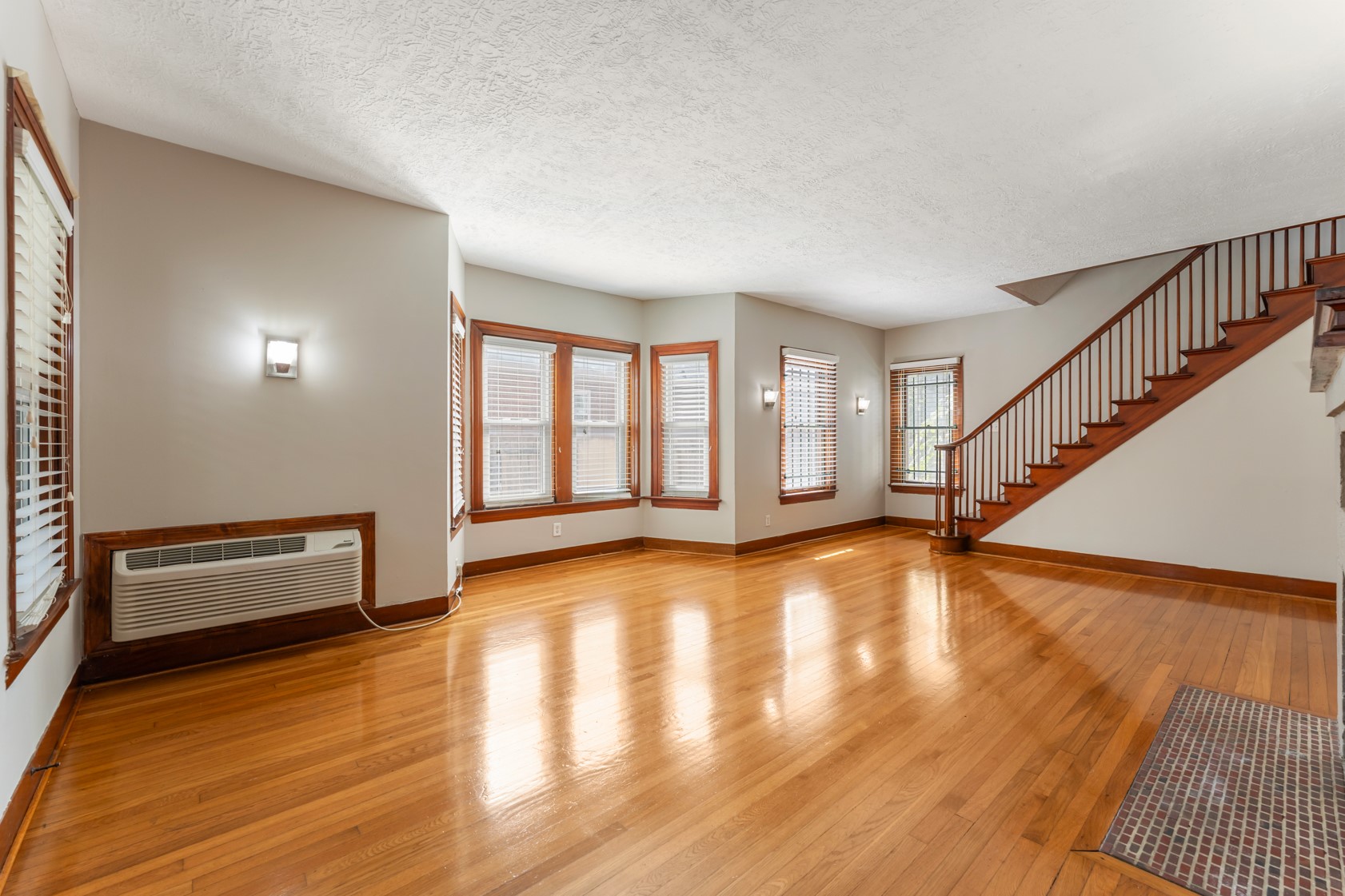 2624 Arbor Street Houston, TX 77004 - Photo 4 of 26 a view of an empty room with wooden floor and a window