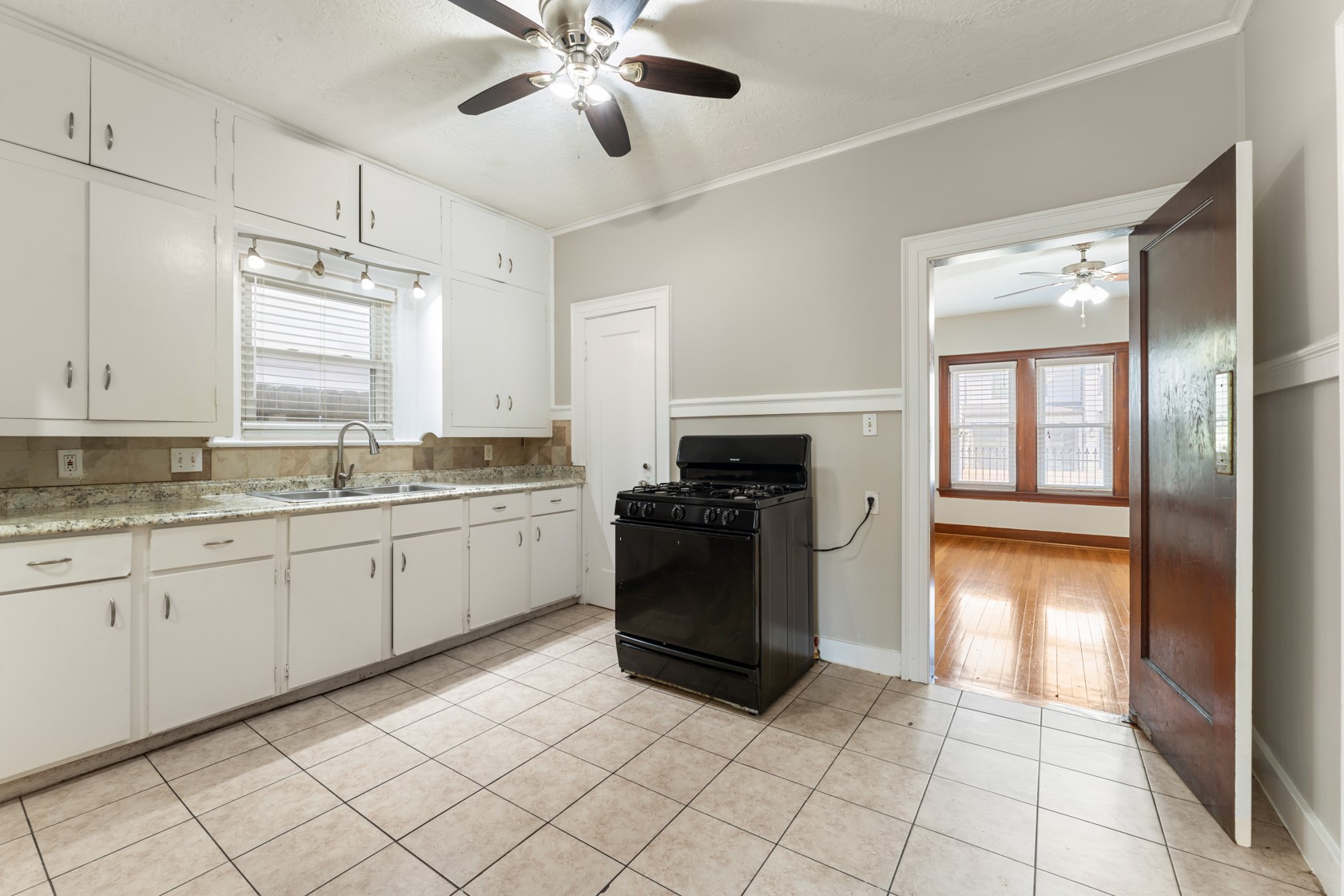 2624 Arbor Street Houston, TX 77004 - Photo 5 of 26 a kitchen with a stove top oven sink and cabinets